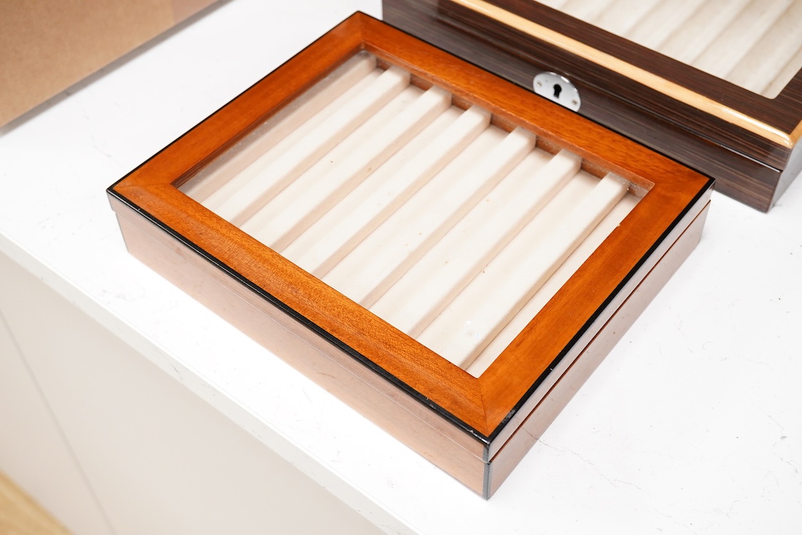 A pair of quality fountain pen desk top cabinets to hold ten and seven pens respectively